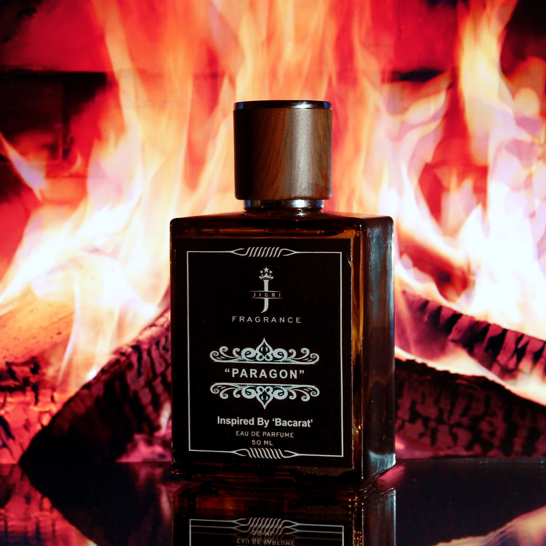 PARAGON fragrance bottle inspired by Baccarat Rouge 540, set against a warm, fiery backdrop, embodying luxury and elegance.