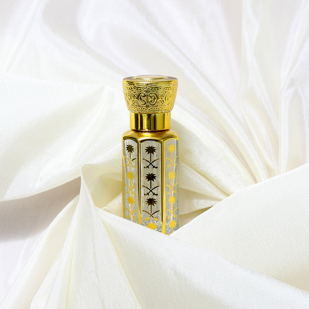 Mehek-e-Noor Attar by Jigri, a luxurious fragrance for men, showcased in an elegant gold and clear bottle.