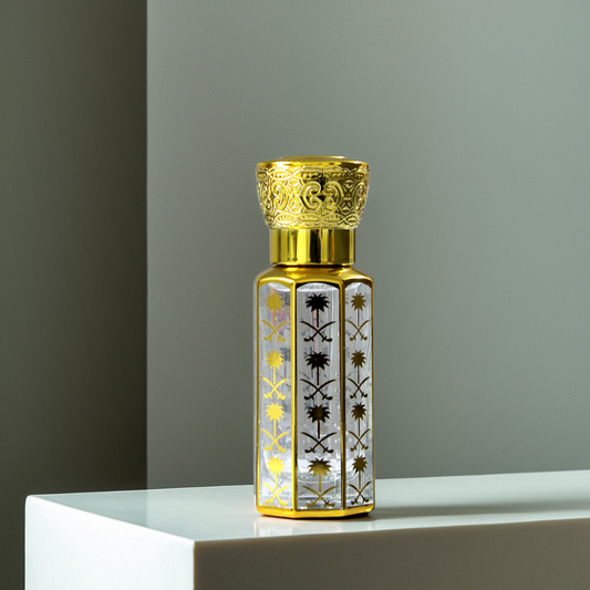 Elegant Taiba attar bottle showcasing a golden cap and intricate design, perfect for men and women fragrances.
